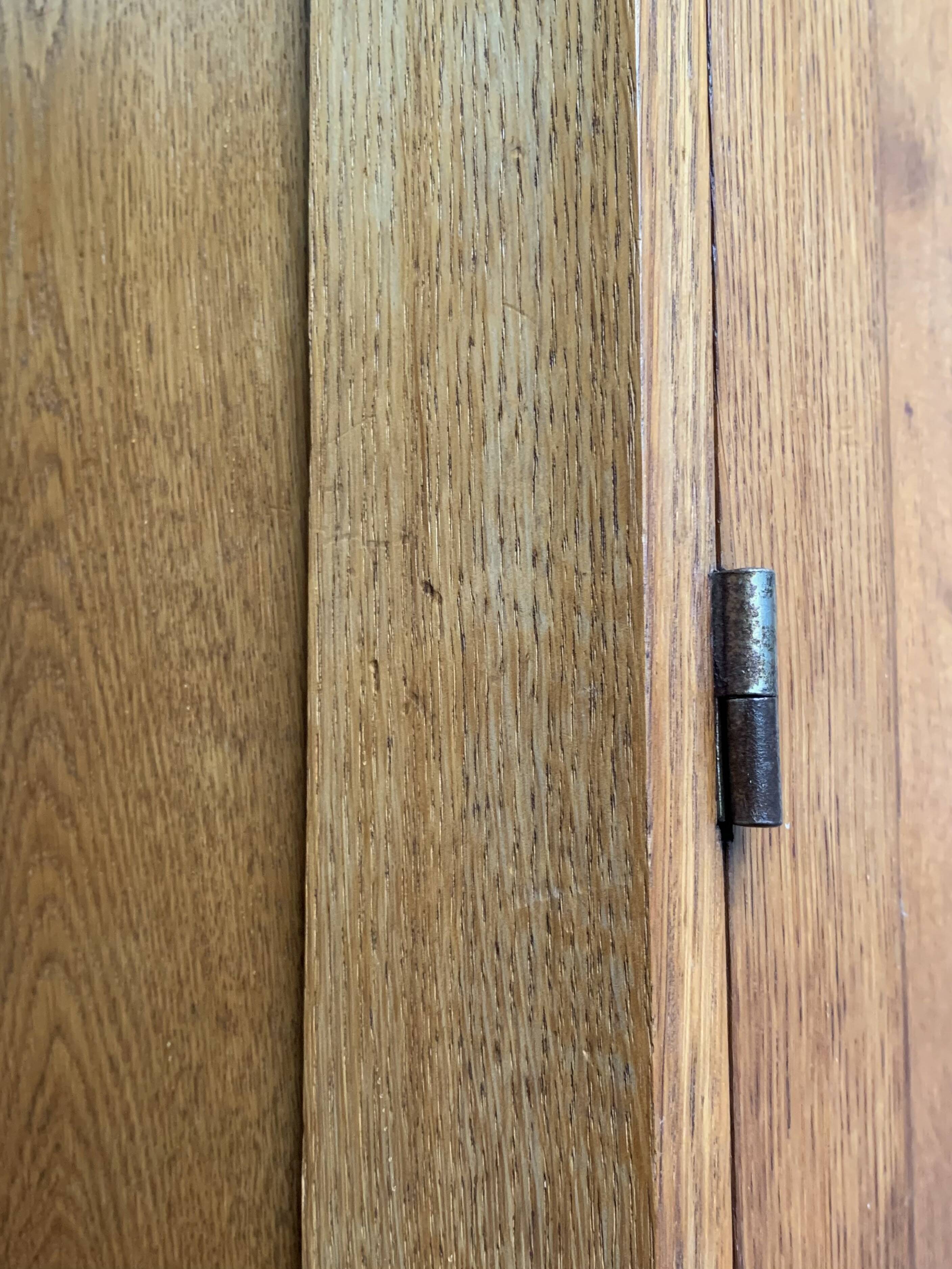 Solid oak compass foot cabinet René Gabriel 1945