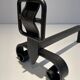 Pair of Wrought Iron Andirons with Obelisk and Belt Motifs