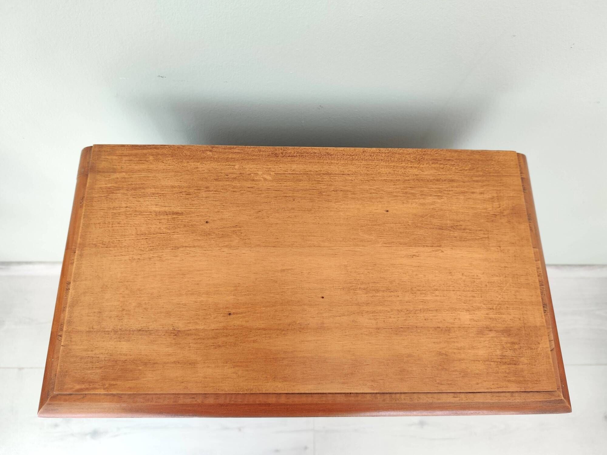 Small wooden piece of furniture, cabinet style, false drawers.