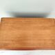 Small wooden piece of furniture, cabinet style, false drawers.