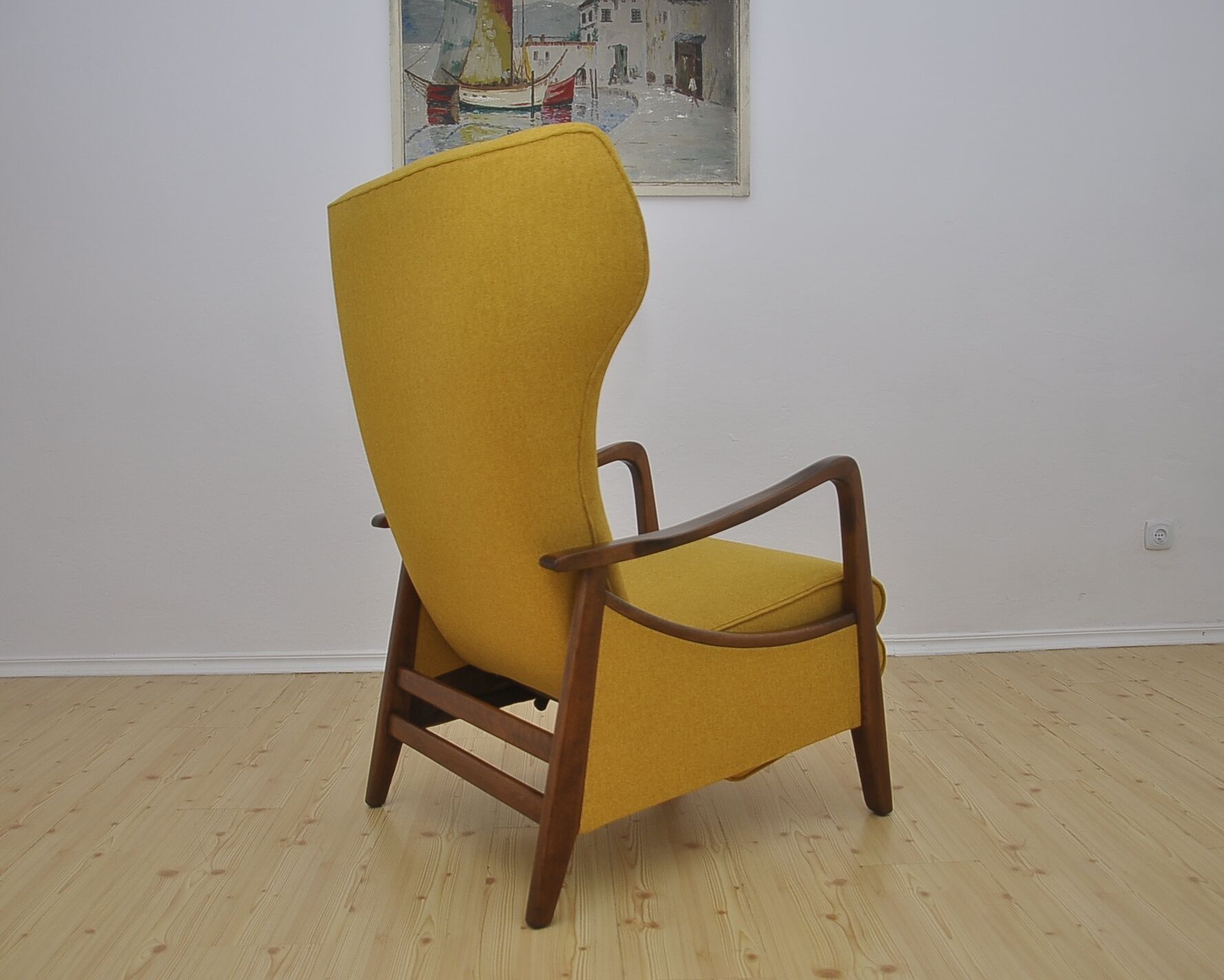 Mid-century Wingback armchair with folding footrest, 1960s