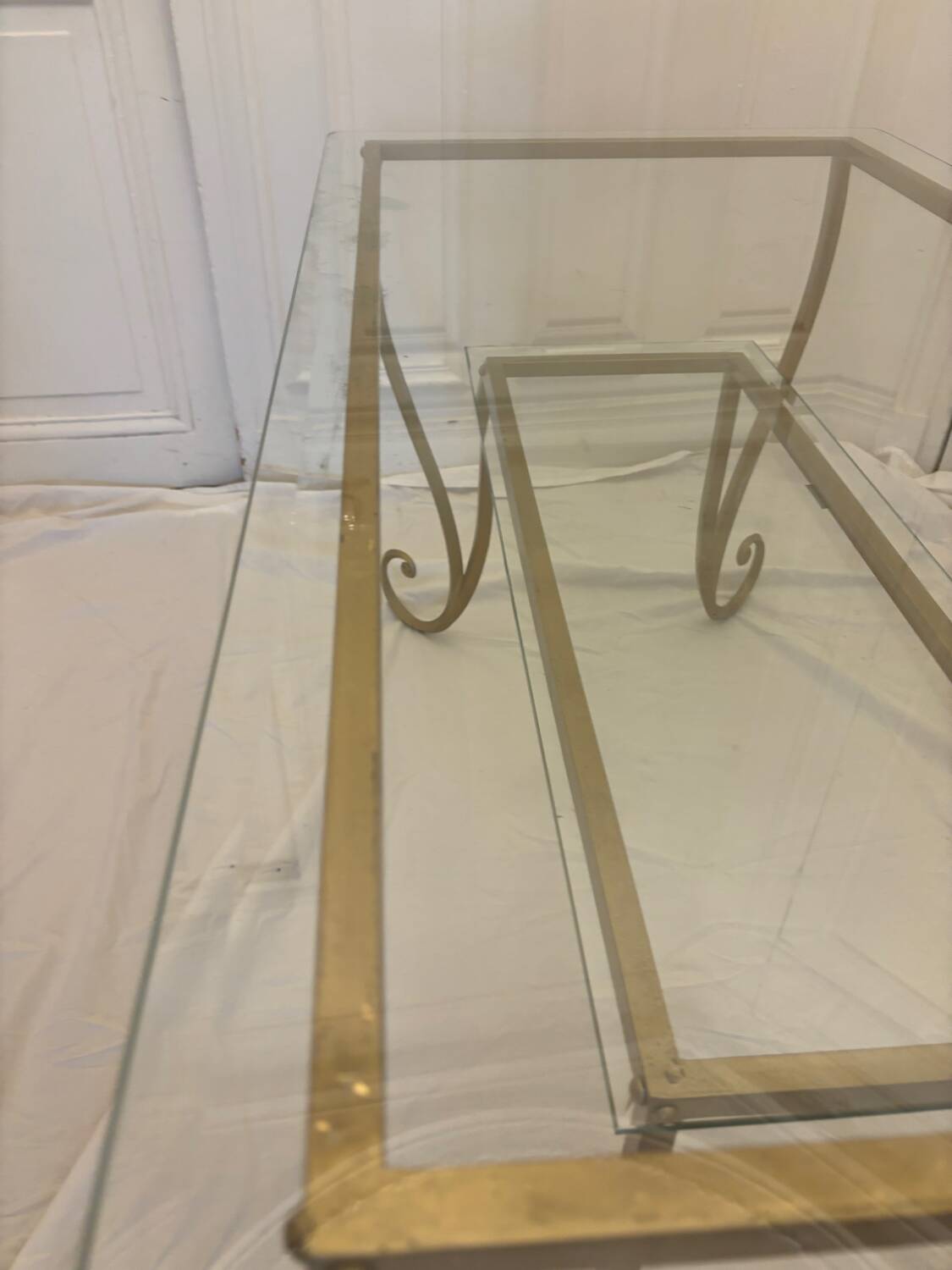 Large gold wrought iron and glass side table.