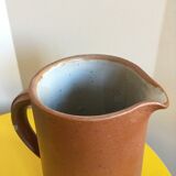 Pitcher in brown sandstone