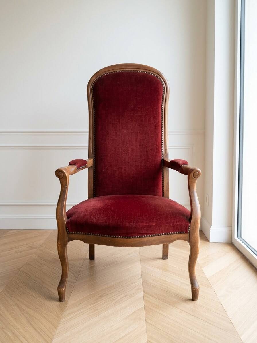 Louis XV style Voltaire armchair in wood and burgundy fabric.