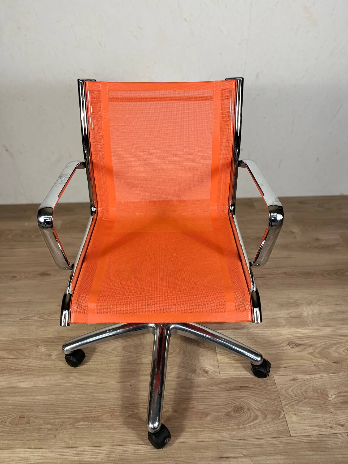 Designer office chair - Orange mesh and chrome base