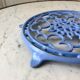 Cast iron coaster painted sky blue early twentieth century