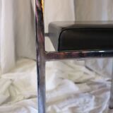 Modernist chair in chromed metal and black imitation leather