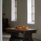 Rustic Scandinavian dining table in stained pine, Sweden, 1900-1940.