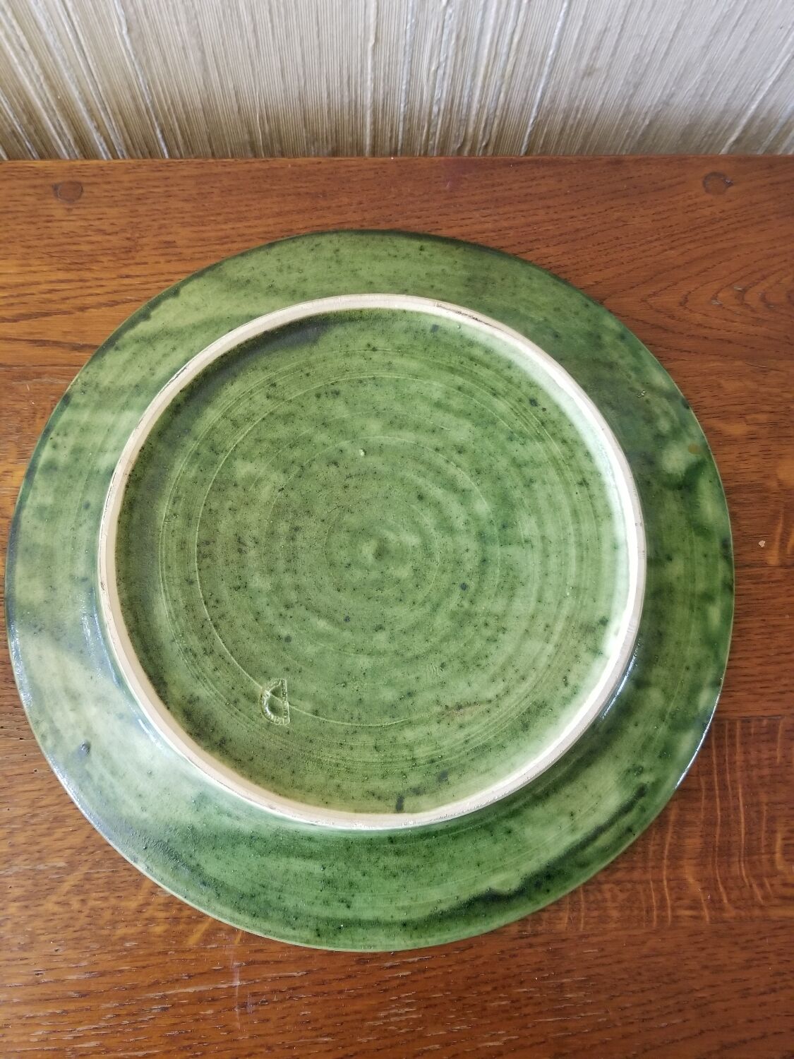 Green earth dish with a pattern from the manufacture Saint Jorioz Annecy