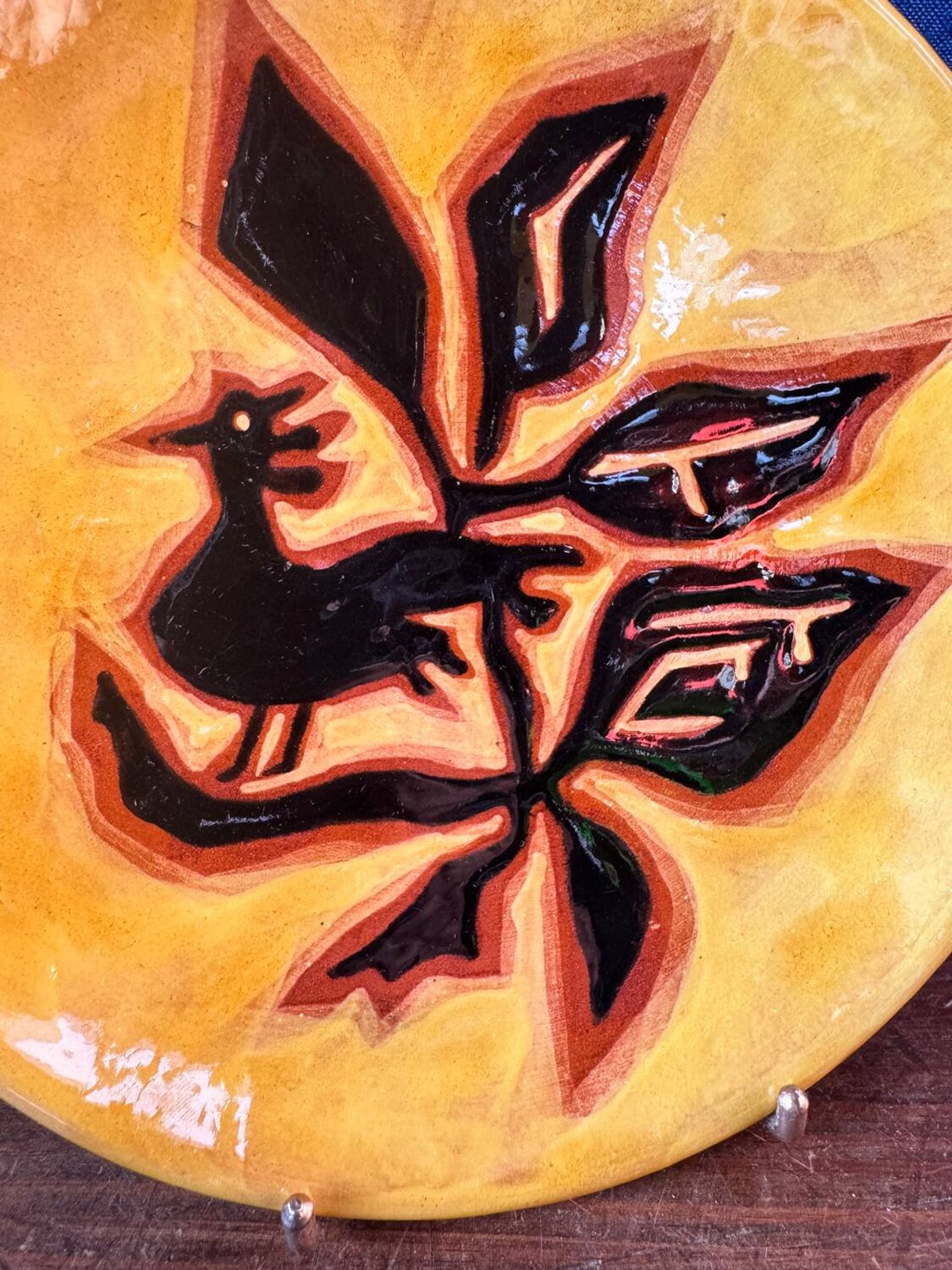 Terracotta plate, Jean Lurçat decorated with a rooster and foliage.