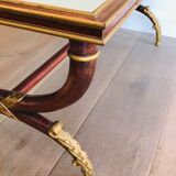 Coffee table in patinated and gilded carved wood with mirror top