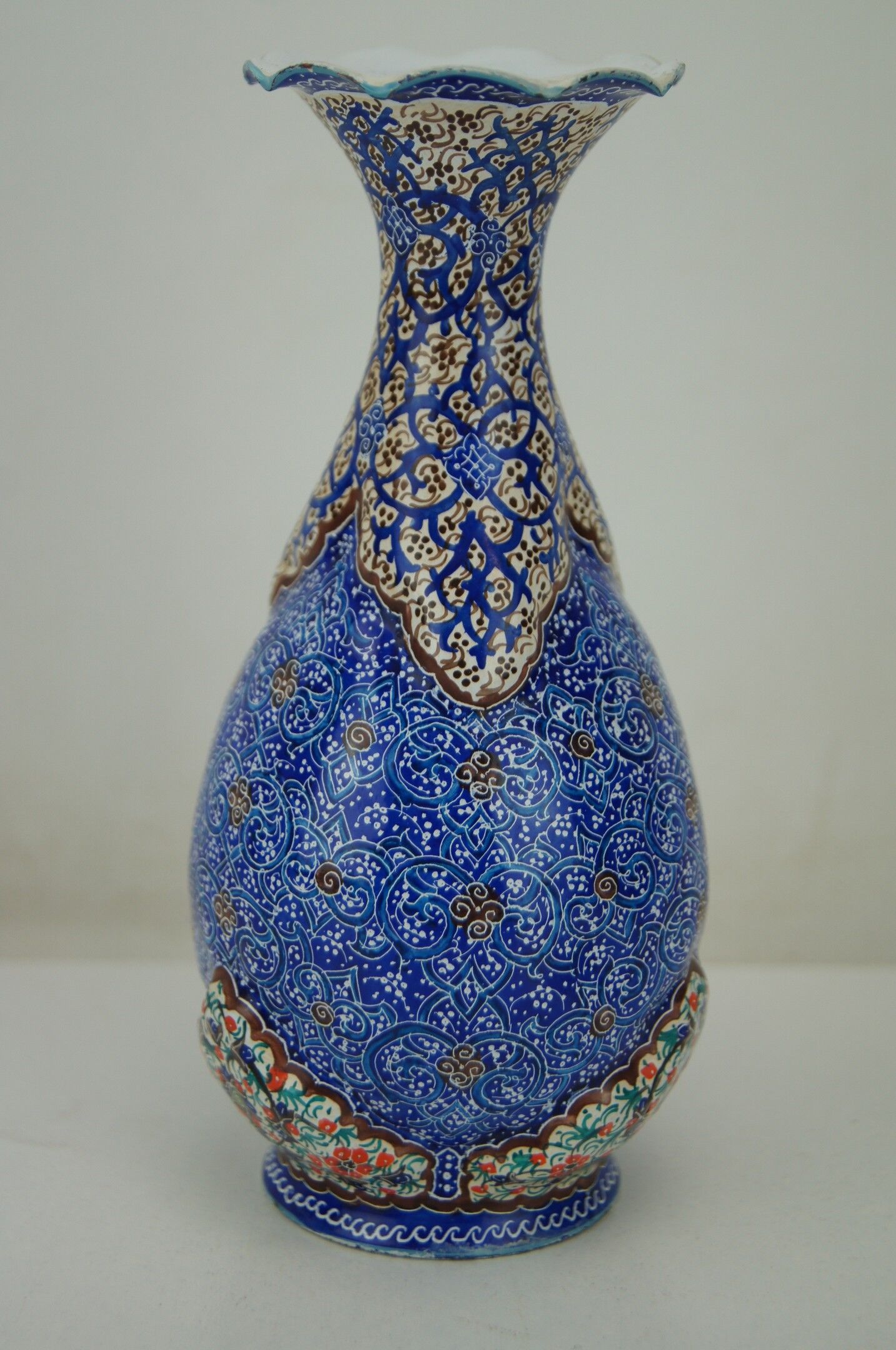 Piriform vase with a flared metal collar enamelled with a polychrome decoration, marked "Amini Iran" on the reverse.