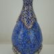 Piriform vase with a flared metal collar enamelled with a polychrome decoration, marked "Amini Iran" on the reverse.