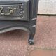 Louis XV style chest of drawers, black patina.
