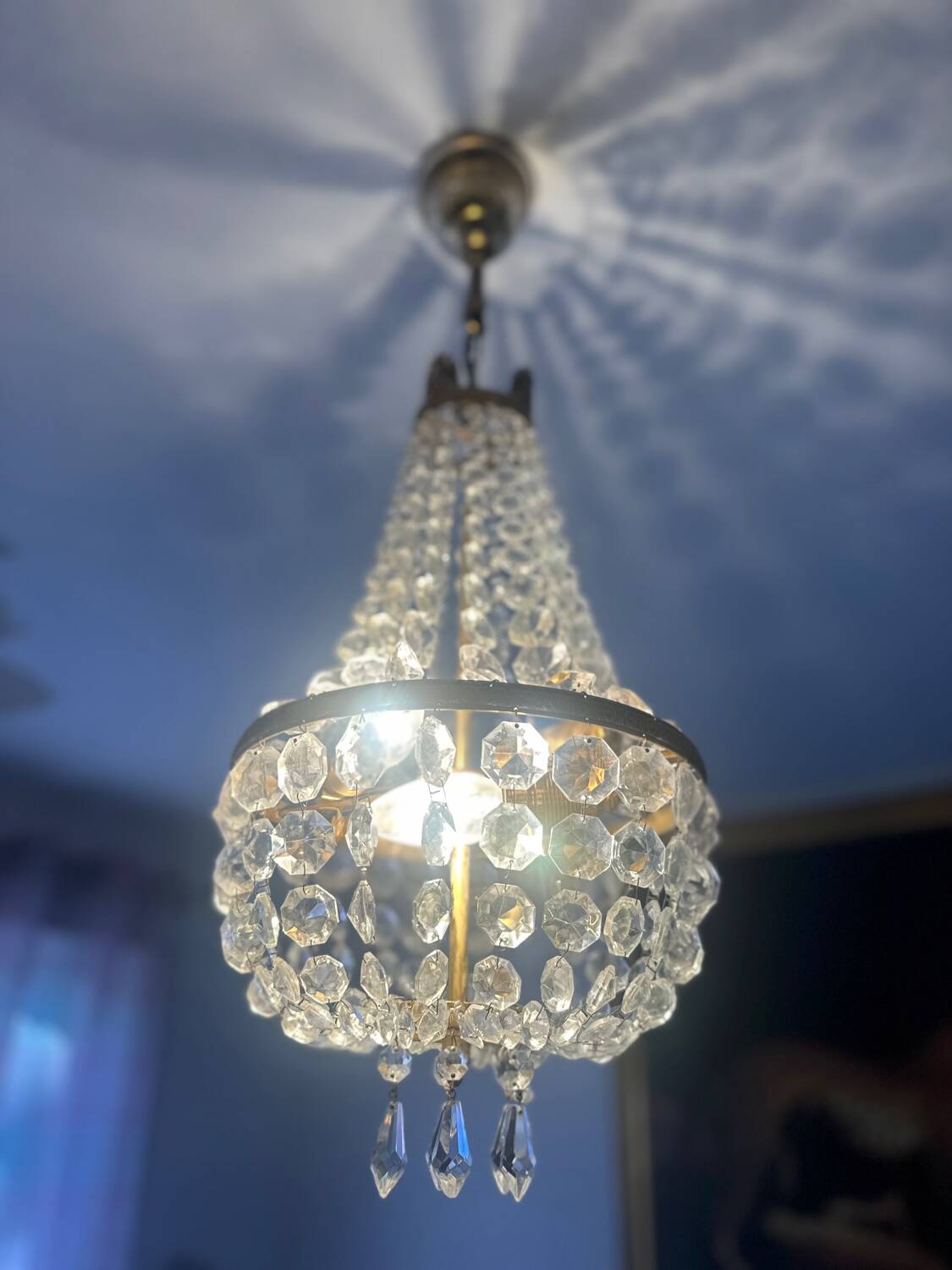Basket chandelier with crystal and gilded brass pendants, circa 1930.