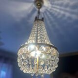 Basket chandelier with crystal and gilded brass pendants, circa 1930.
