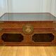 Beautiful vintage Chinese trunk in wicker, black and gold lacquered wood, and brass.