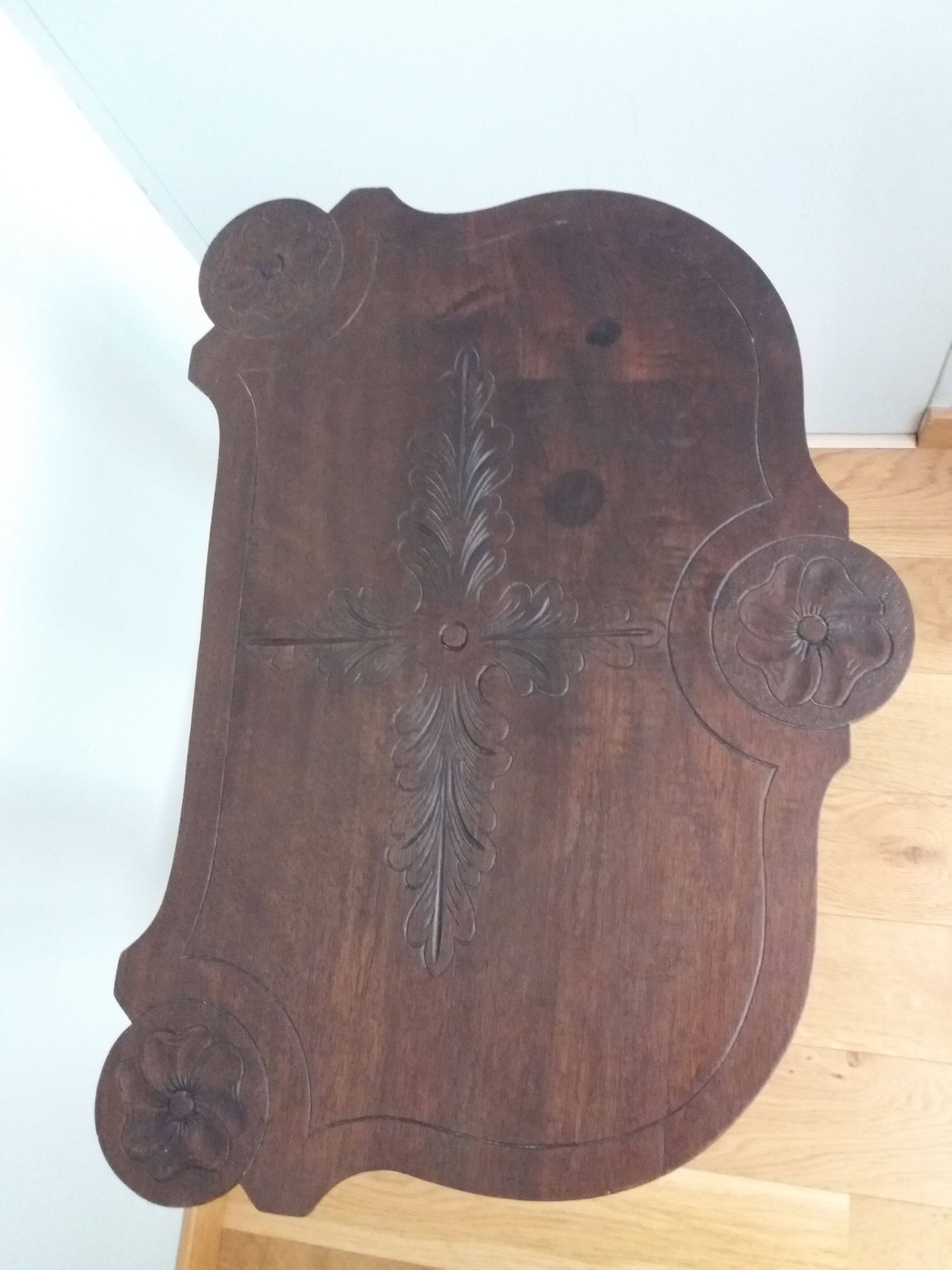 Triplet console harness in carved wood