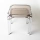 Pair of chrome nesting tables with smoked glass tops