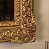 Miroir régence en bois sculpté doré début XVIIIème siècle