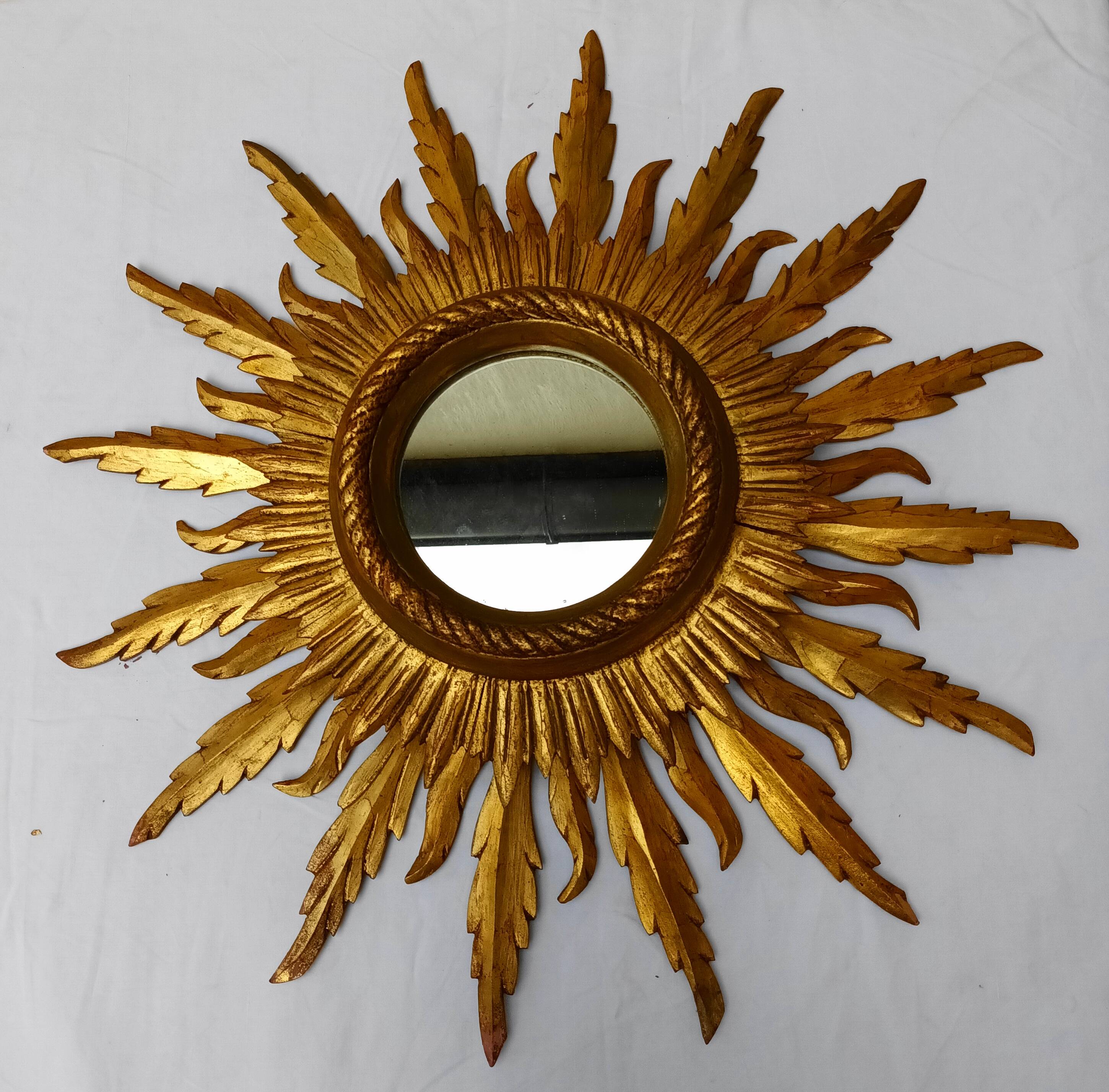 Sun mirror in carved gilded wood from the 1950s
