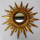 Sun mirror in carved gilded wood from the 1950s