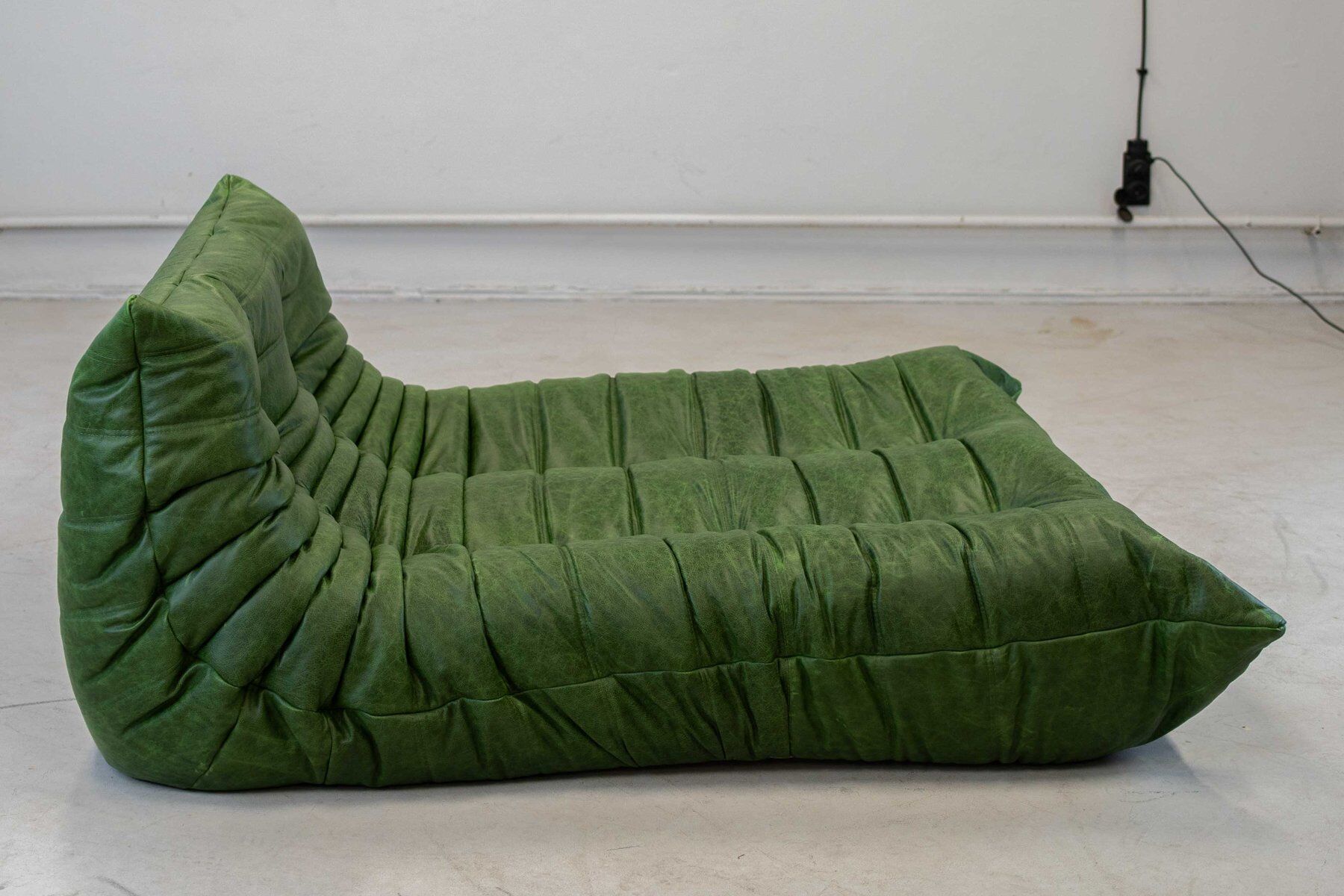 Togo chaise lounge in green leather attributed to Michel Ducaroy for Ligne Roset, 1974