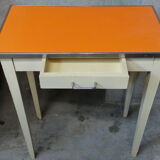 Orange wood and formica table
