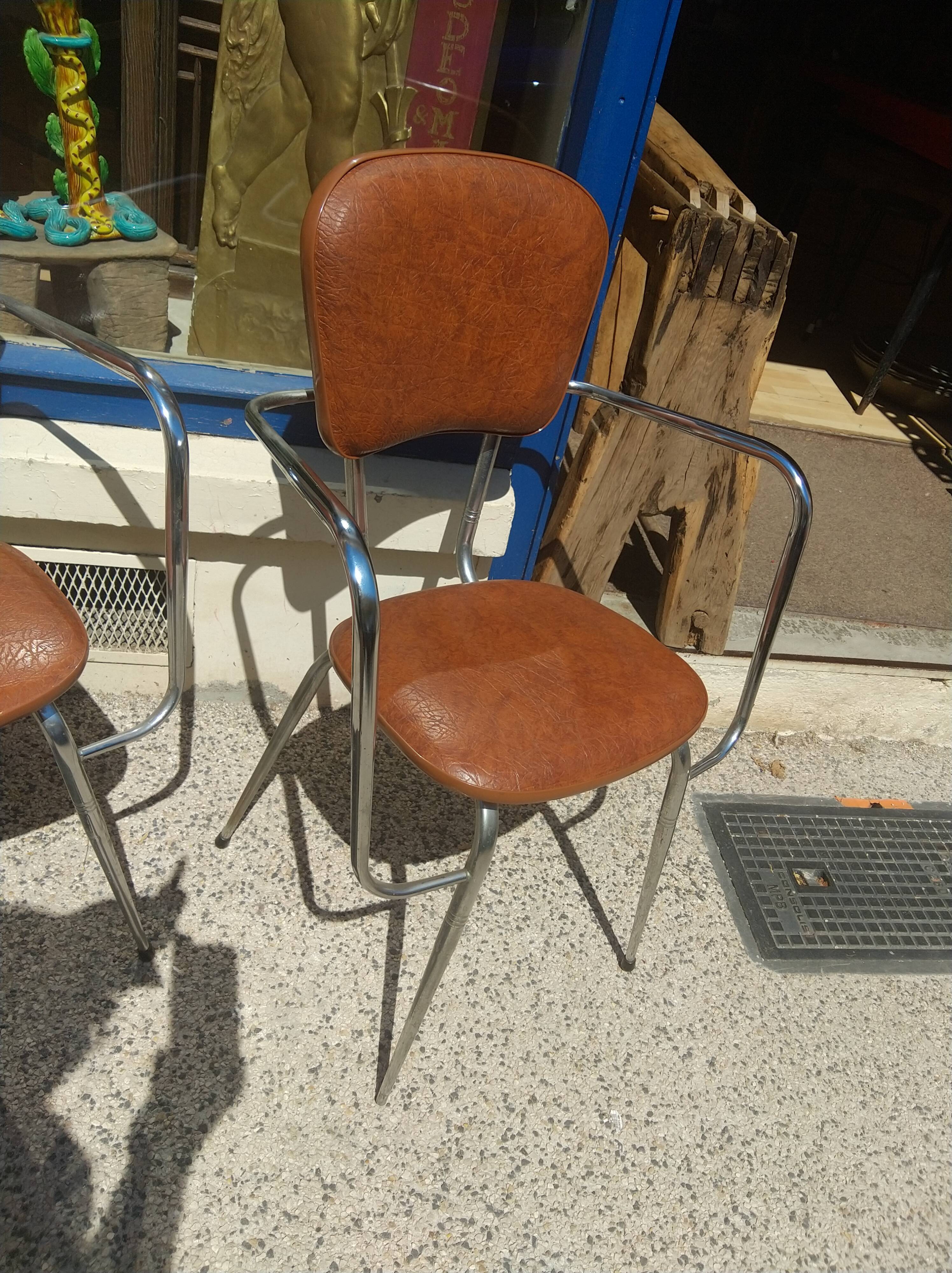 Set of 4 armchairs in chromed metal and brown imitation leather, circa 1960