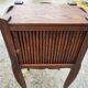 Pair of oak bedside tables with curtained niche doors