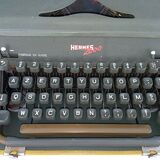 Hermes 2000 portable typewriter with its carrying suitcase