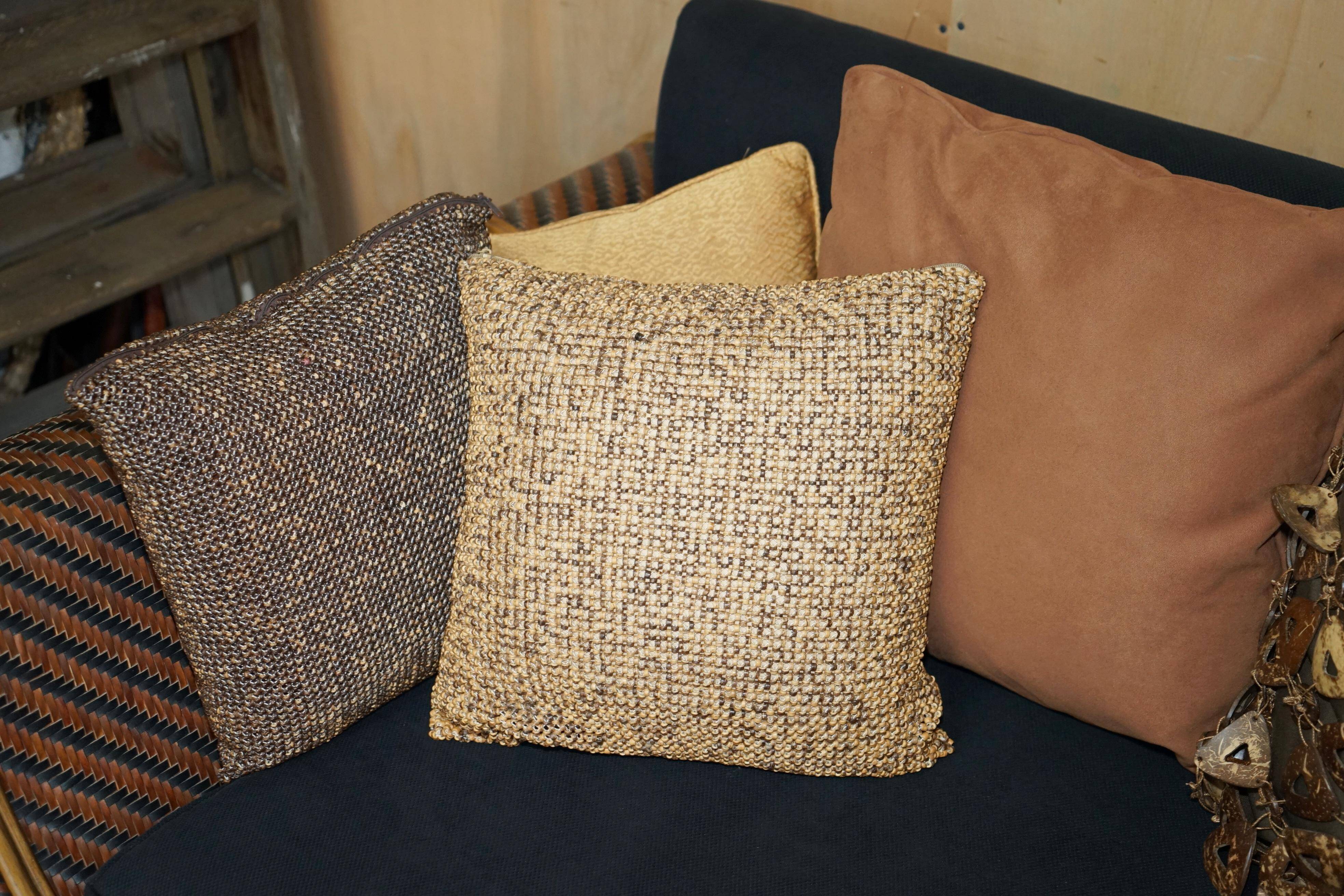 Vintage 1970s canapé with bamboo frame and Aztec patterns.