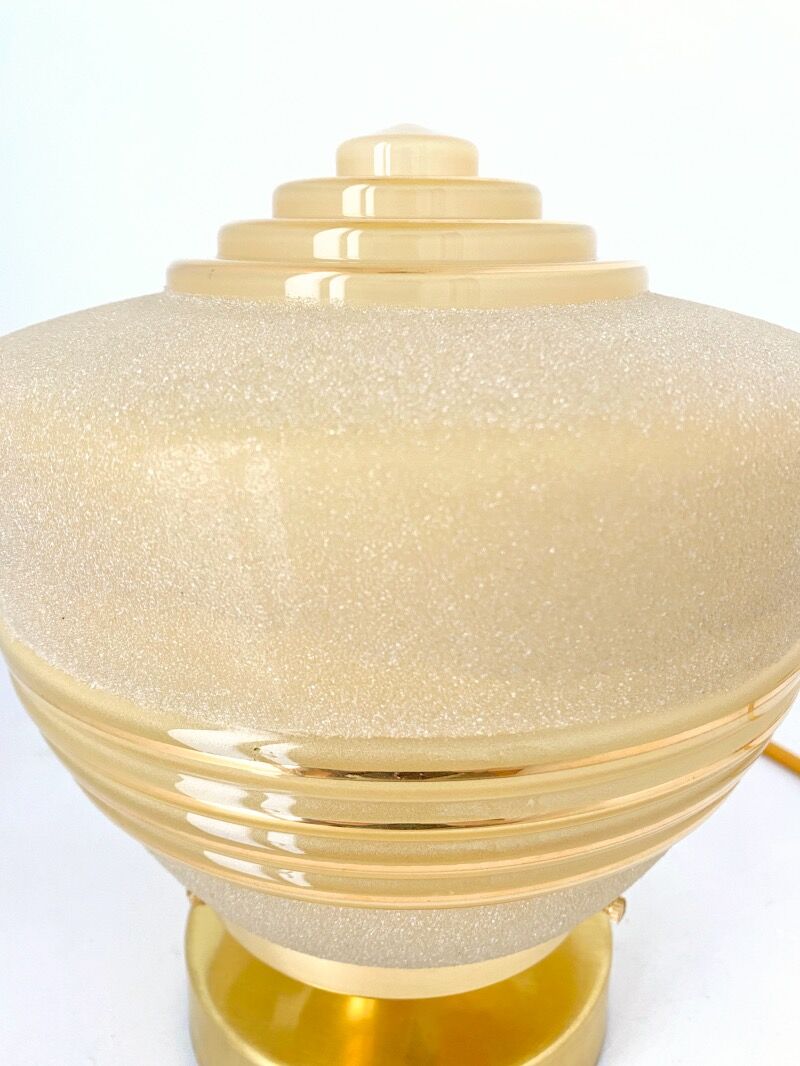 Old globe table lamp in beige and gold glass
