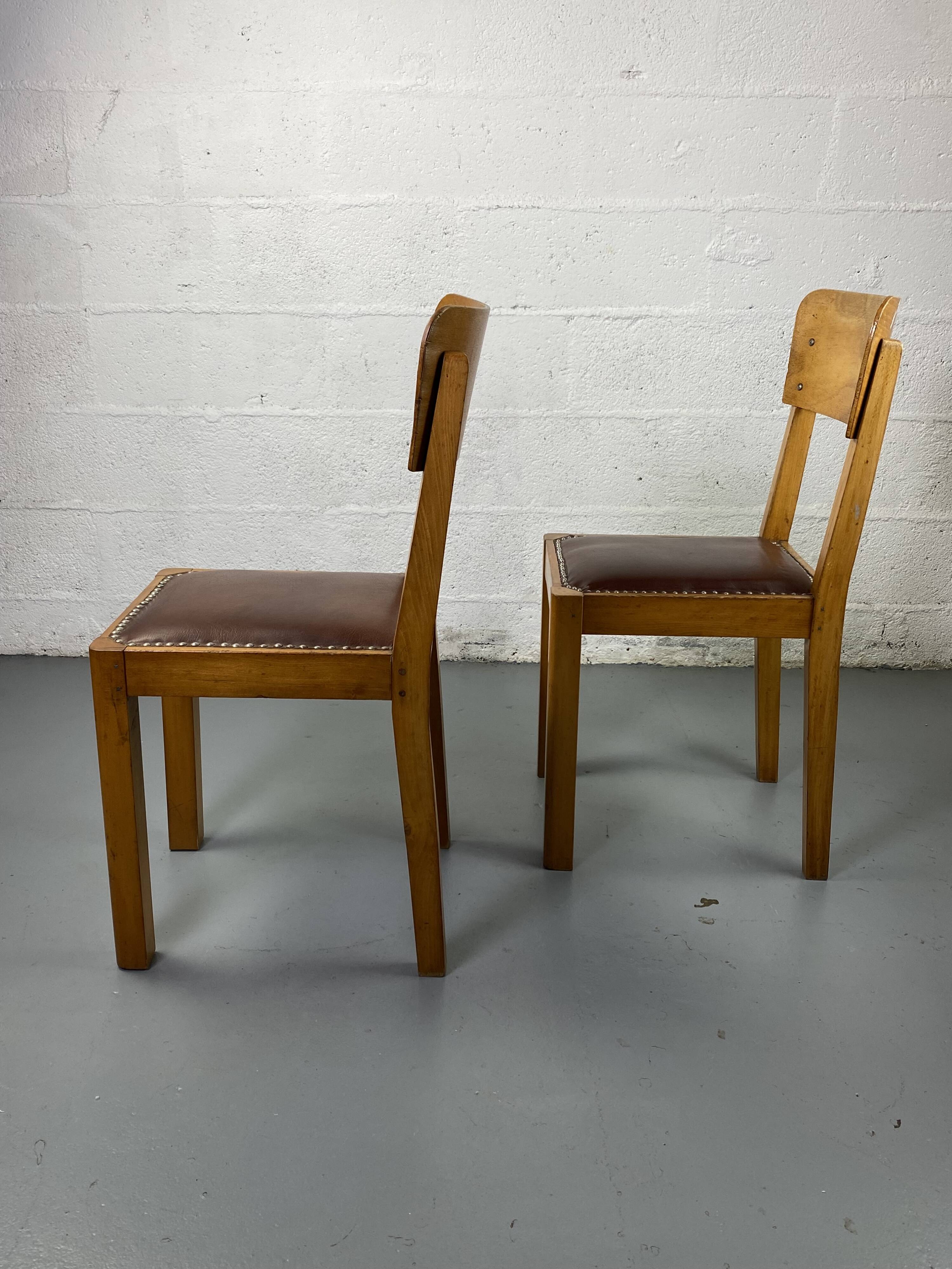 Pair of wooden and leather chairs