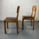 Pair of wooden and leather chairs