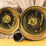 Set of 2 glazed pottery candle holders signed