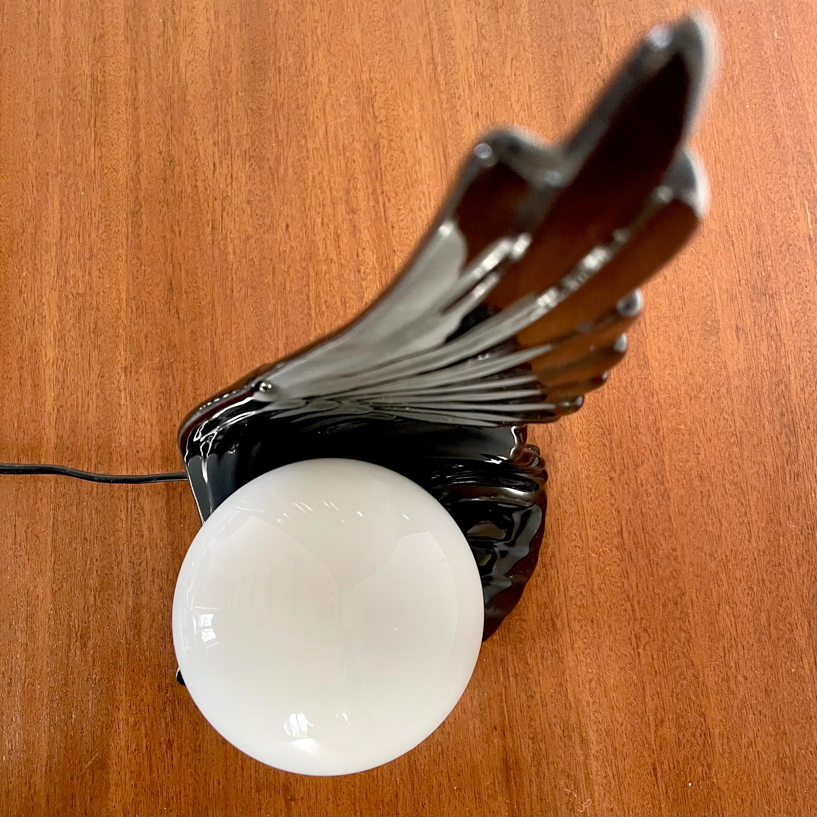 Ceramic wing and globe lamp