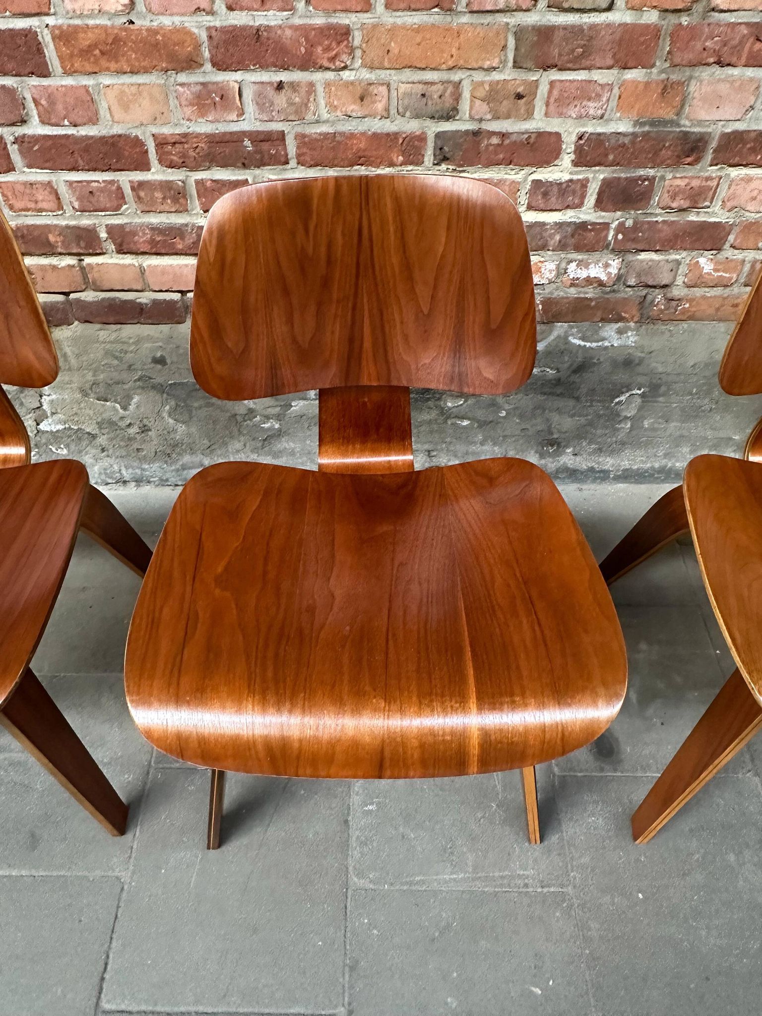 Set of 4 DCW chairs in walnut, Charles & Ray Eames, Herman Miller, 1950s