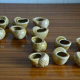 Lot of 12 enamelled sandstone snail shells