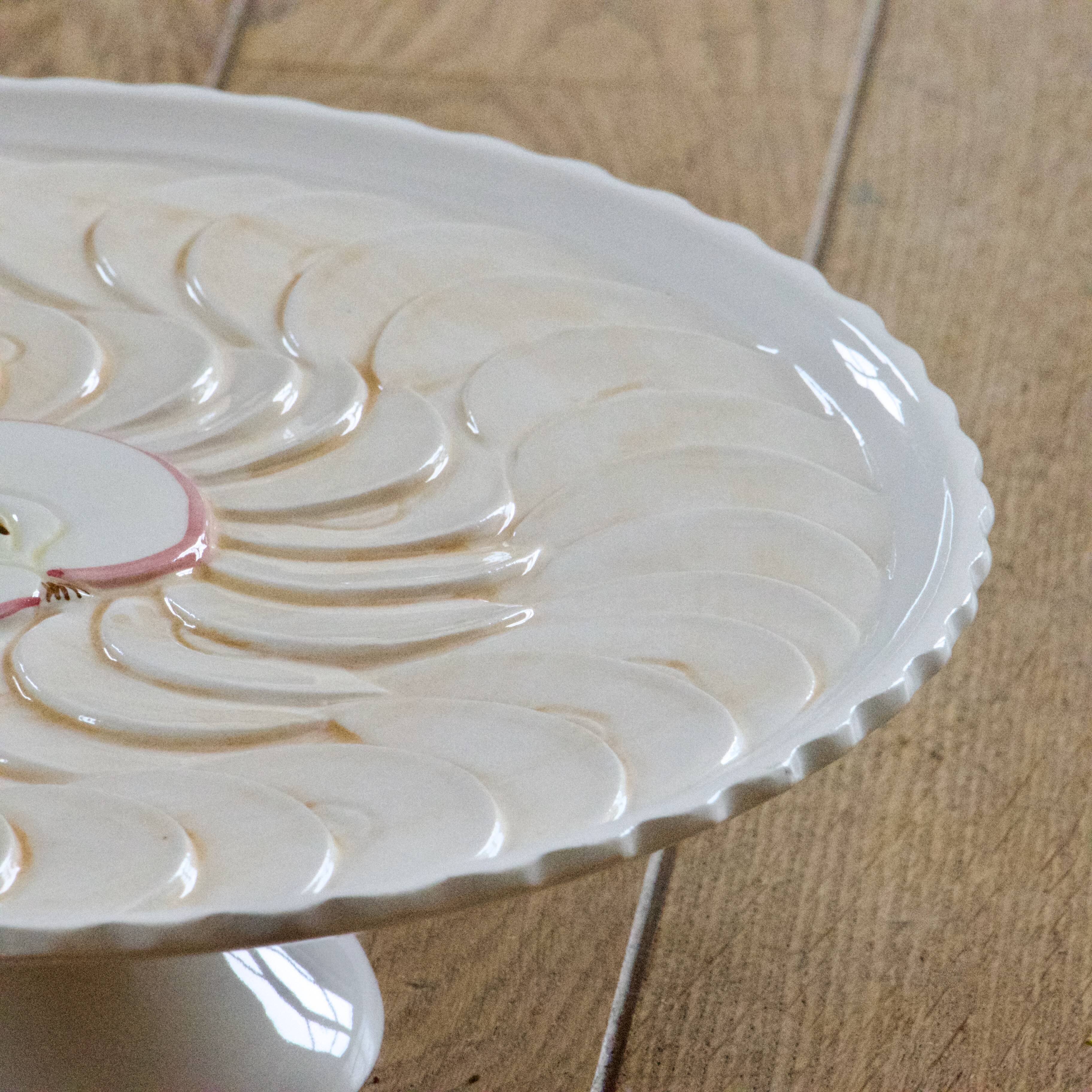 Large vintage earthenware pie dish on a pedestal, apple pie