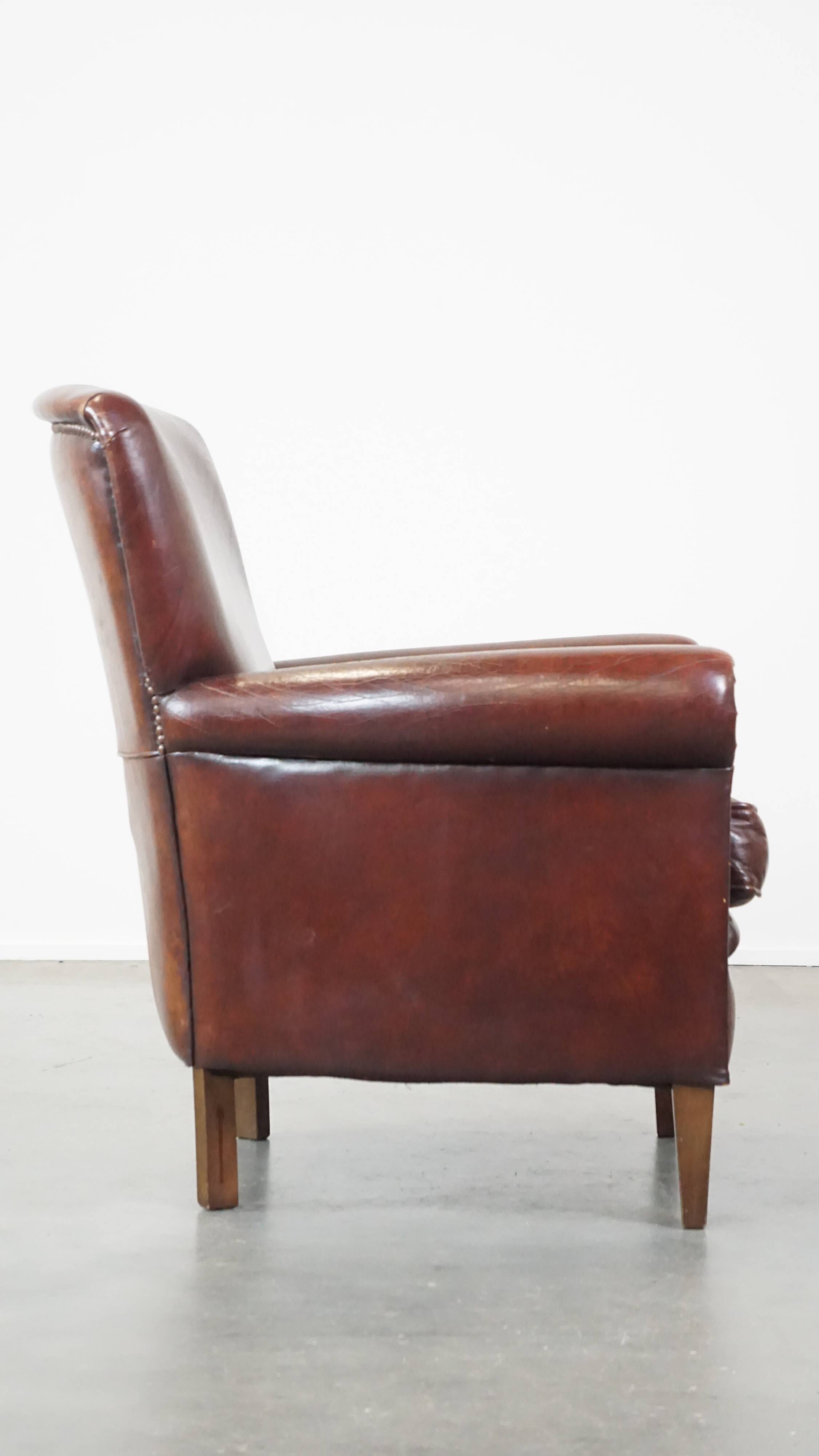 Sheep leather armchair correctly finished with decorative nails