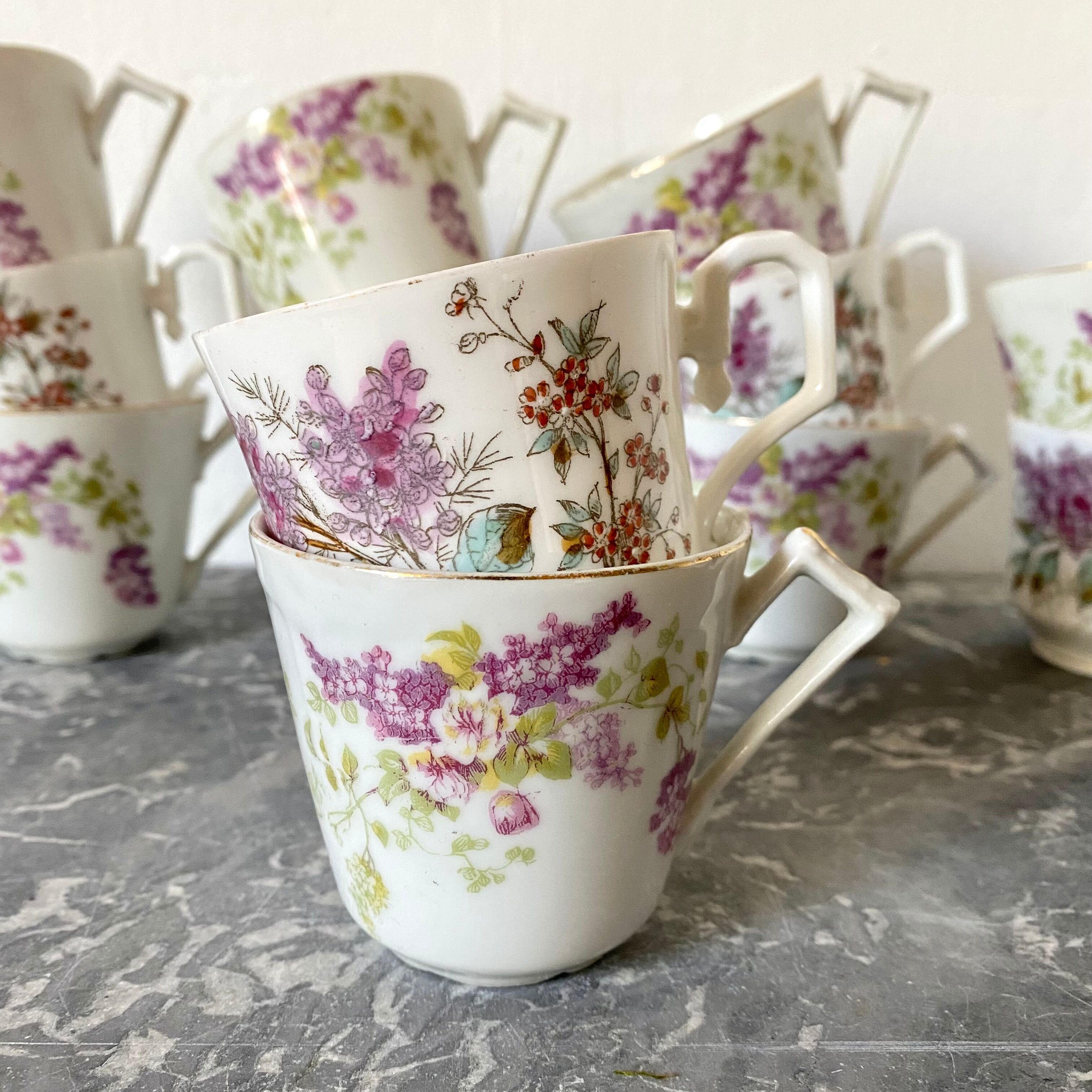 Antique flowered porcelain cups mismatched