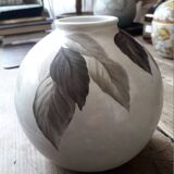 Vintage vase signed with a plant decoration