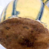 Yellow, blue and green rustic pitcher