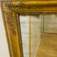 Antique mercury mirror with an Empire gold frame.