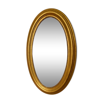 Golden oval mirror