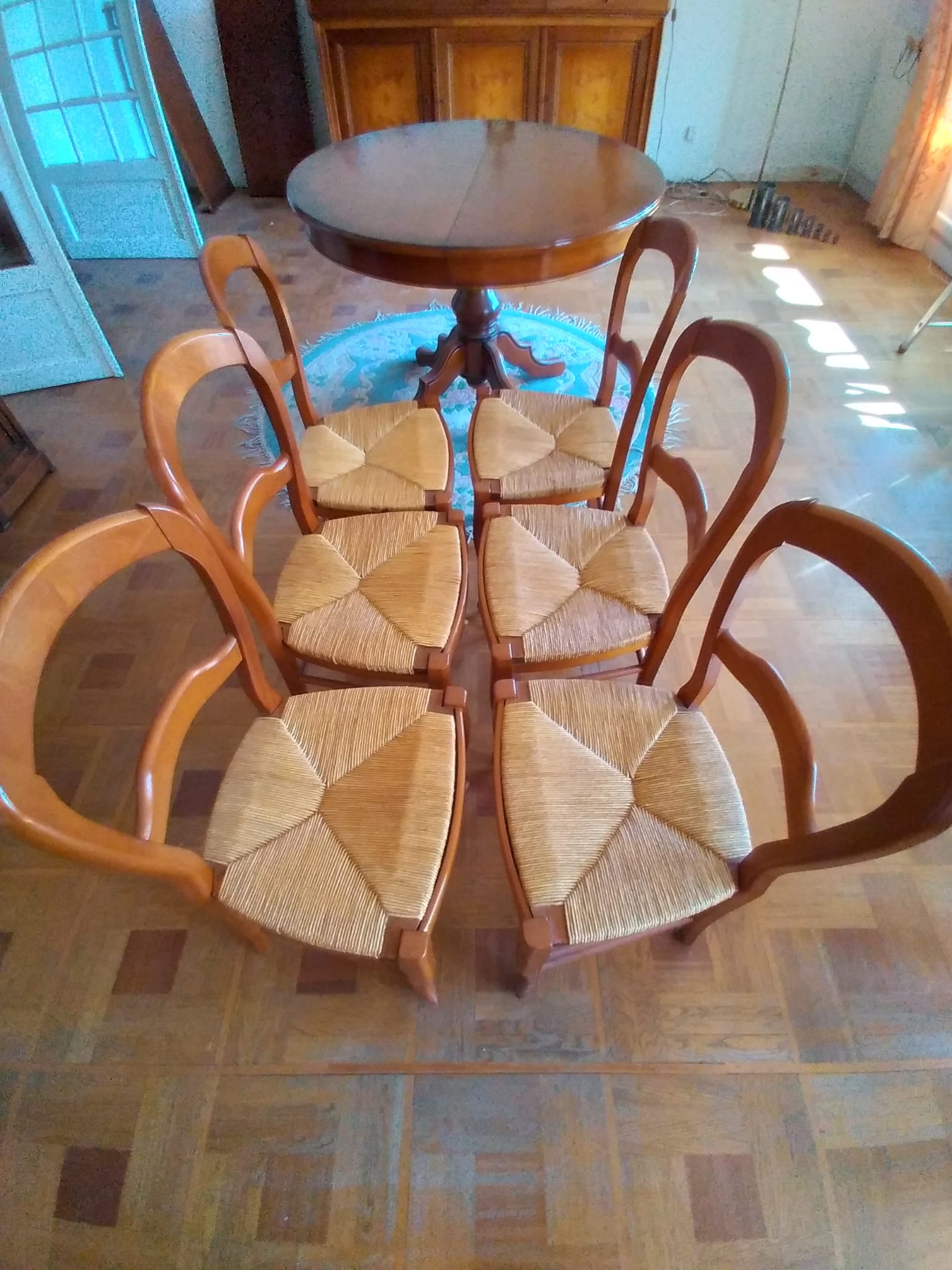 6 mulched solid wood chairs and 2 canework chairs