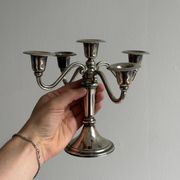 Candlestick candle holder in patinated silver metal
