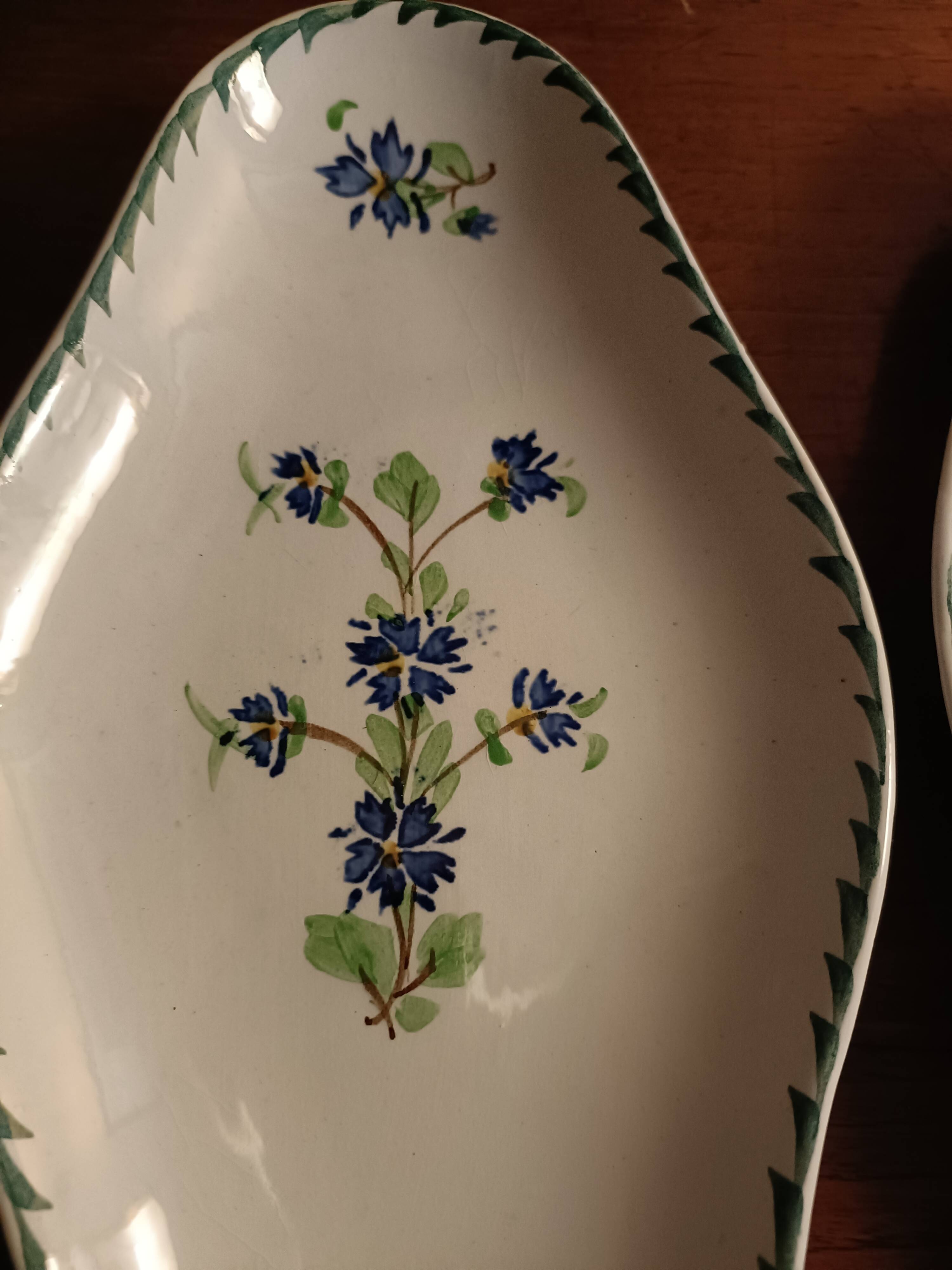 Two iron clay bowls decorated with cornflowers.