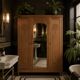 Art deco wardrobe in raw oak with bevelled mirror.